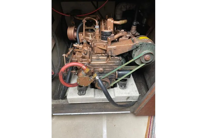 The Image of 1982 O'Day 28 sailboat engine, detailed view of mechanical components. - 1