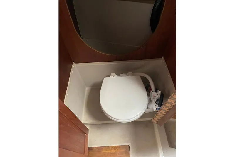Slide: The Image of 1982 O'Day 28 sailboat bathroom with compact marine toilet. - 4