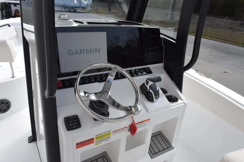 Slide: The Image of 2026 Sea Hunt Ultra 245 SE boat console with Garmin navigation system. - 10