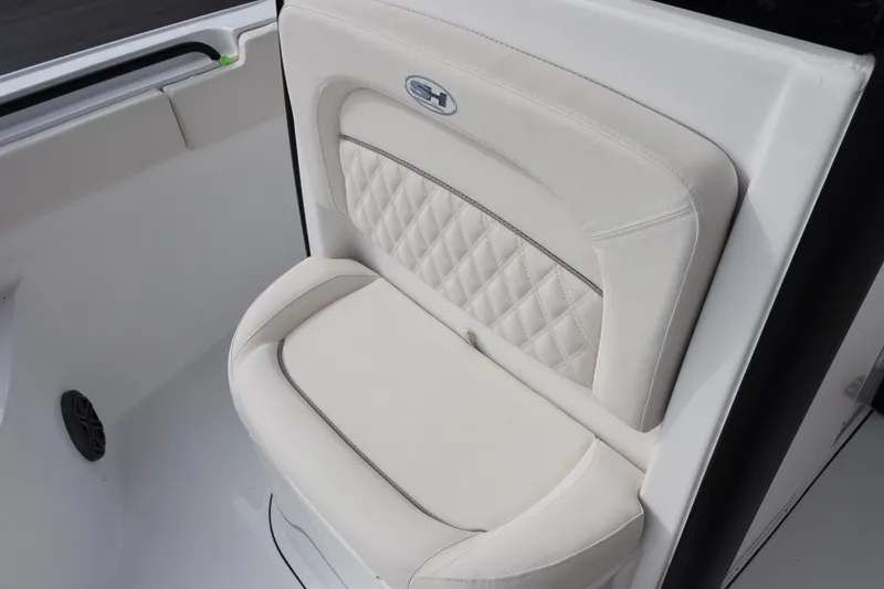 Slide: The Image of 2026 Sea Hunt Ultra 245 SE boat seat with quilted design and logo. - 14