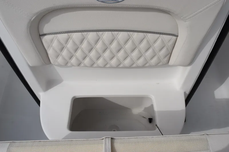 Slide: The Image of 2026 Sea Hunt Ultra 245 SE boat seat with quilted upholstery and storage compartment. - 16