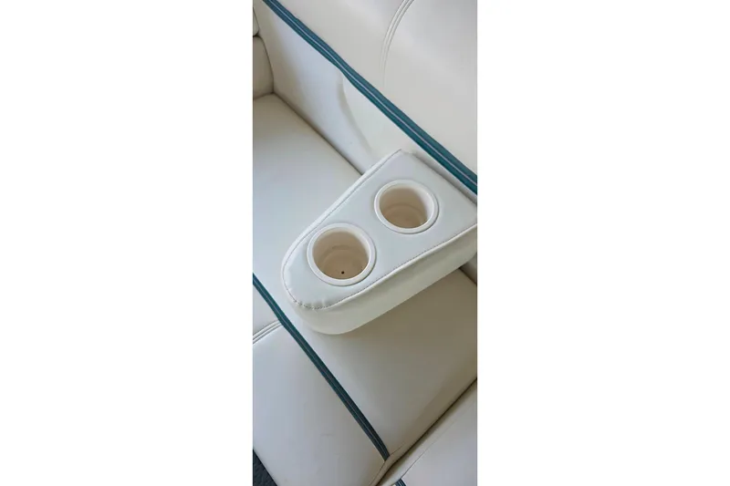 Slide: The Image of 2004 Sanpan 2500 RE pontoon boat with Yamaha outboard motor on calm water. - 25