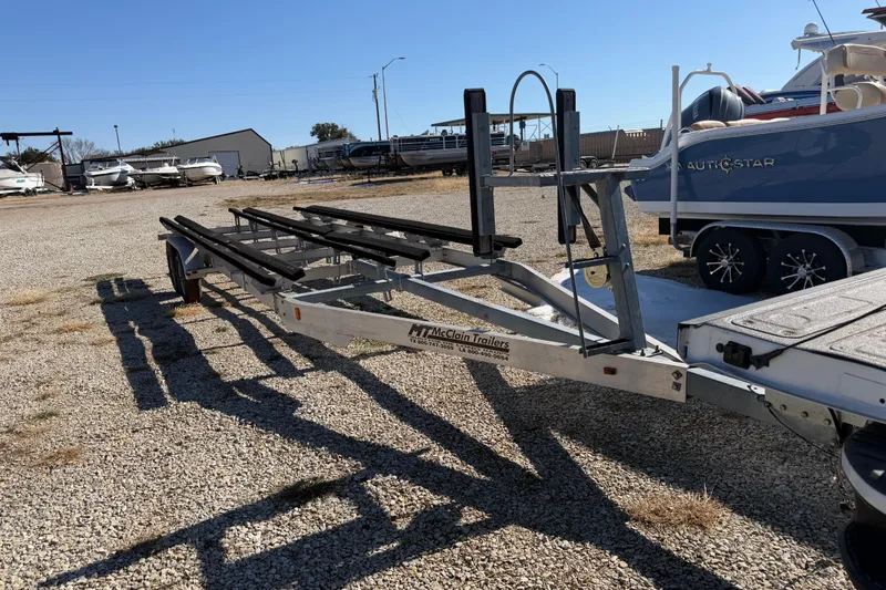 Slide: The Image of Battery compartment of 2004 Sanpan 2500 RE with marine batteries and red cables. - 35