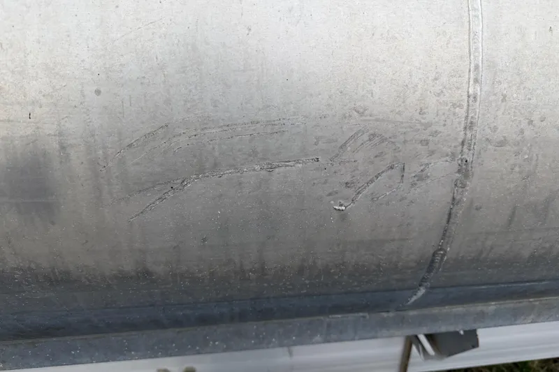 Slide: The Image of Close-up of scratched metal surface on 2004 Sanpan 2500 RE boat. - 43