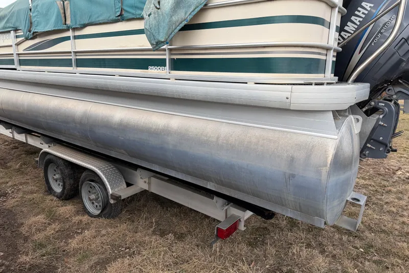 Slide: The Image of 2004 Sanpan 2500 RE pontoon boat on trailer with Yamaha outboard motor. - 48