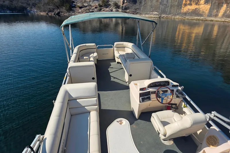 Slide: The Image of 2004 Sanpan 2500 RE pontoon boat with canopy on a serene lake. - 5