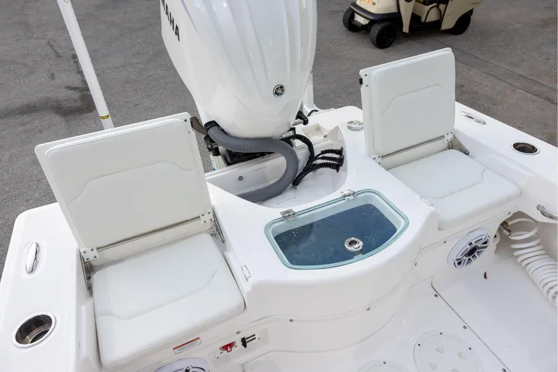 Slide: The Image of 2023 Everglades 243 Center Console boat with Yamaha engine and seating area. - 6