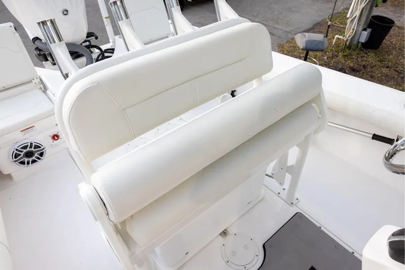 Slide: The Image of 2023 Everglades 243 Center Console boat with white seating and console area. - 8