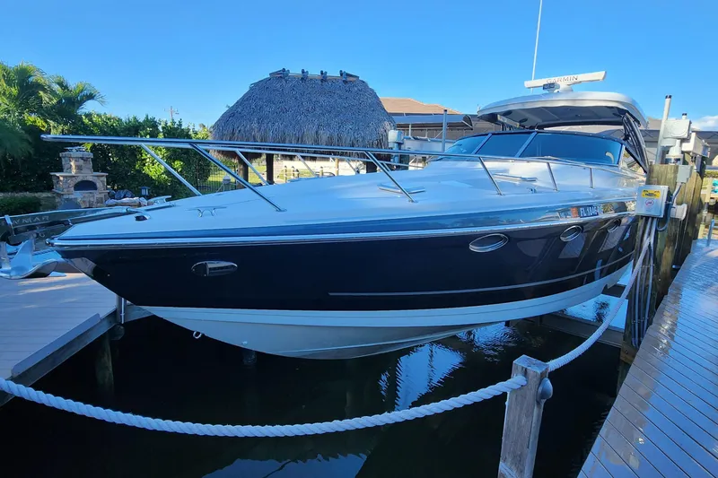 Slide: The Image of 2017 Formula 370 Super Sport boat docked, featuring sleek design and modern amenities. - 13