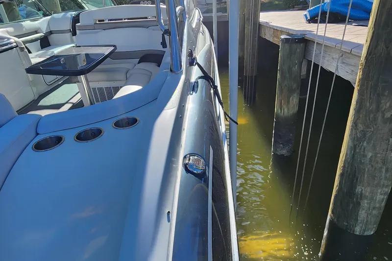 Slide: The Image of 2017 Formula 370 Super Sport boat docked, showcasing sleek interior and exterior design. - 17