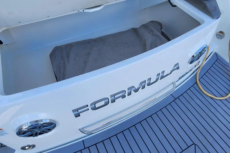 Slide: The Image of 2017 Formula 370 Super Sport boat storage compartment with open lid and visible interior. - 20