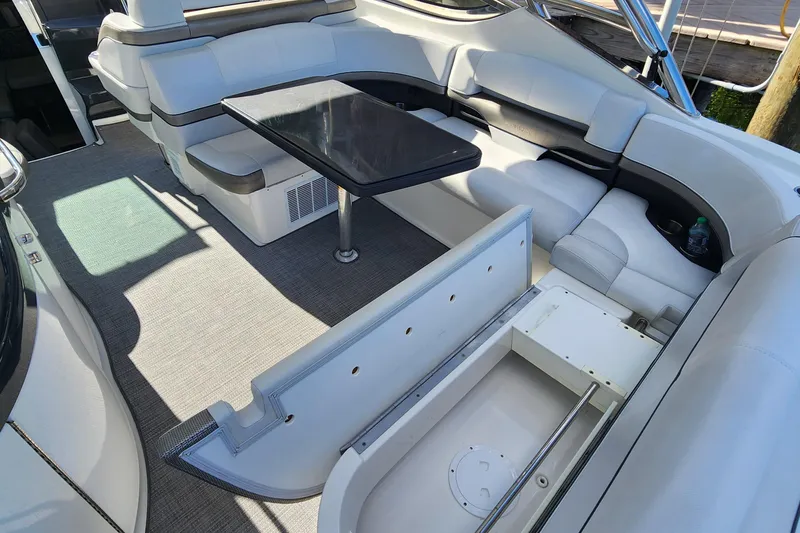 Slide: The Image of 2017 Formula 370 Super Sport boat interior with seating and table. - 24