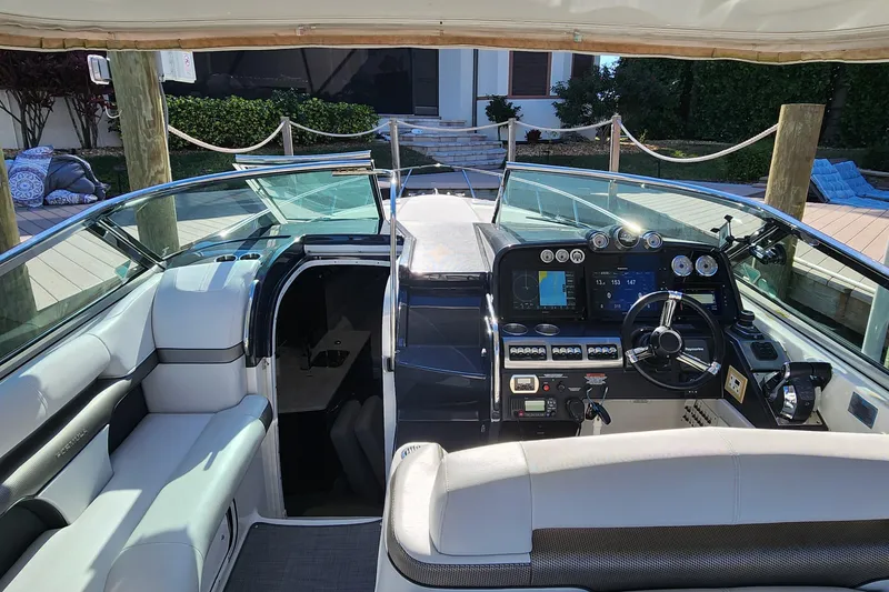Slide: The Image of 2017 Formula 370 Super Sport boat cockpit with modern controls and seating. - 28