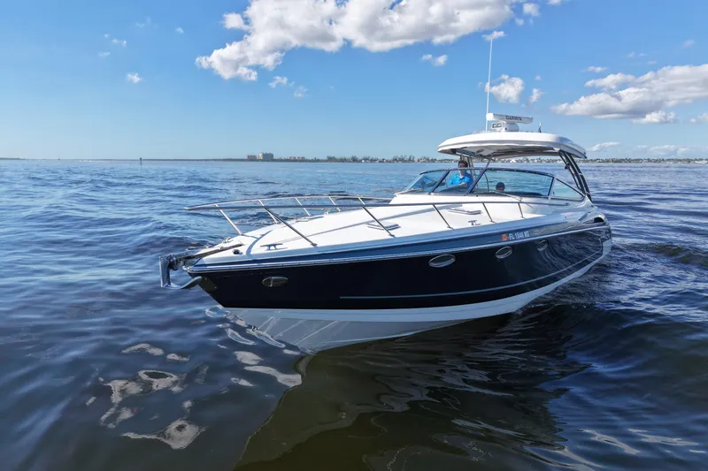 Slide: The Image of 2017 Formula 370 Super Sport boat cruising on open water under a clear blue sky. - 3