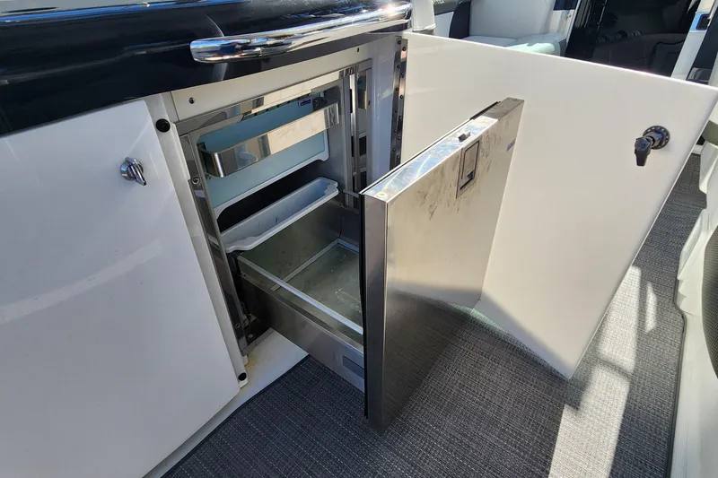 Slide: The Image of Open cabinet with stainless steel drawer on 2017 Formula 370 Super Sport boat. - 30