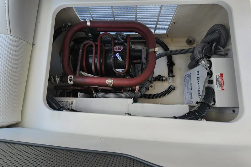 Slide: The Image of Engine compartment of a 2017 Formula 370 Super Sport boat, showcasing mechanical components. - 31