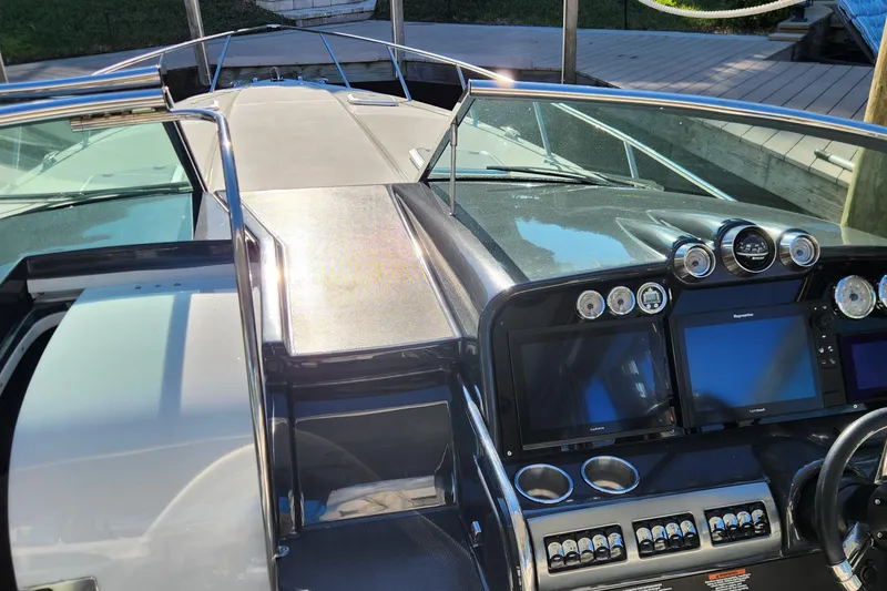 Slide: The Image of 2017 Formula 370 Super Sport boat dashboard with navigation screens and controls. - 33