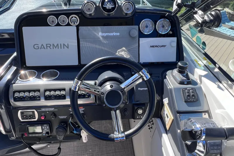 Slide: The Image of Cockpit of 2017 Formula 370 Super Sport with Garmin and Raymarine navigation systems. - 35