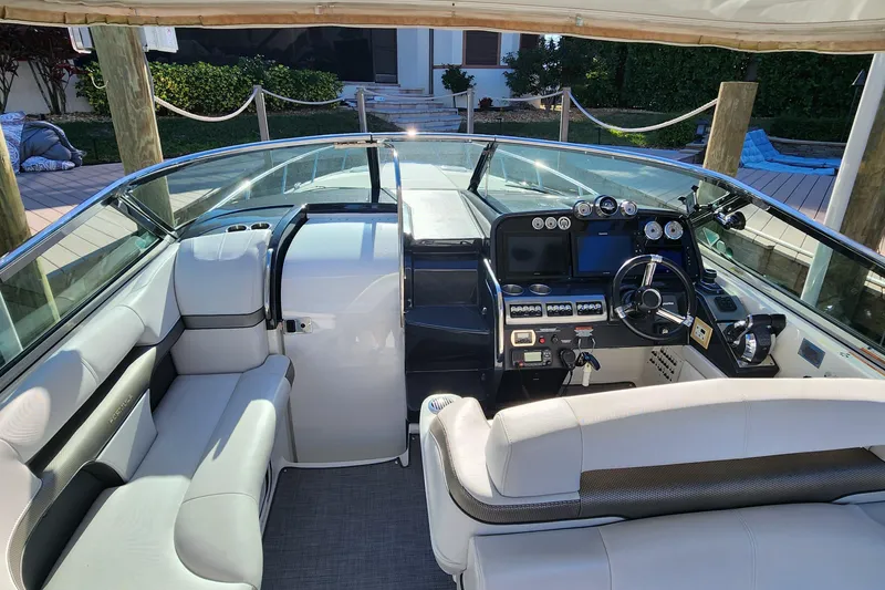 Slide: The Image of 2017 Formula 370 Super Sport boat interior with modern dashboard and seating. - 38
