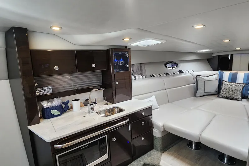 Slide: The Image of Luxurious interior of a 2017 Formula 370 Super Sport yacht with modern kitchen and seating area. - 42