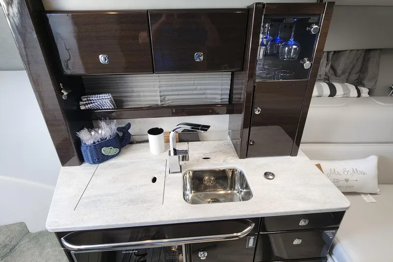 Slide: The Image of Luxurious 2017 Formula 370 Super Sport yacht interior with modern kitchenette and elegant cabinetry. - 43