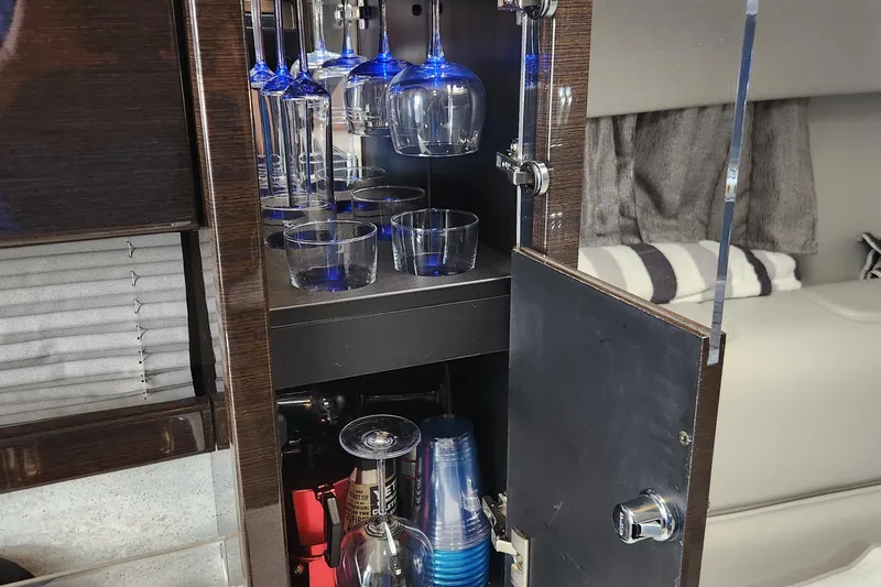 Slide: The Image of Bar cabinet with glassware inside a 2017 Formula 370 Super Sport yacht. - 44