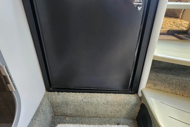 Slide: The Image of Interior of 2017 Formula 370 Super Sport boat with carpeted flooring and steps. - 50