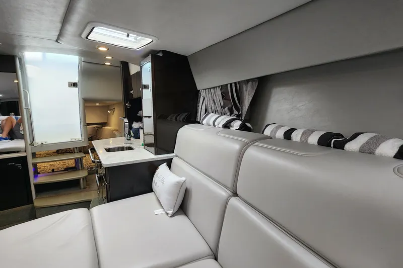 Slide: The Image of Interior of 2017 Formula 370 Super Sport yacht with modern seating and kitchenette. - 51