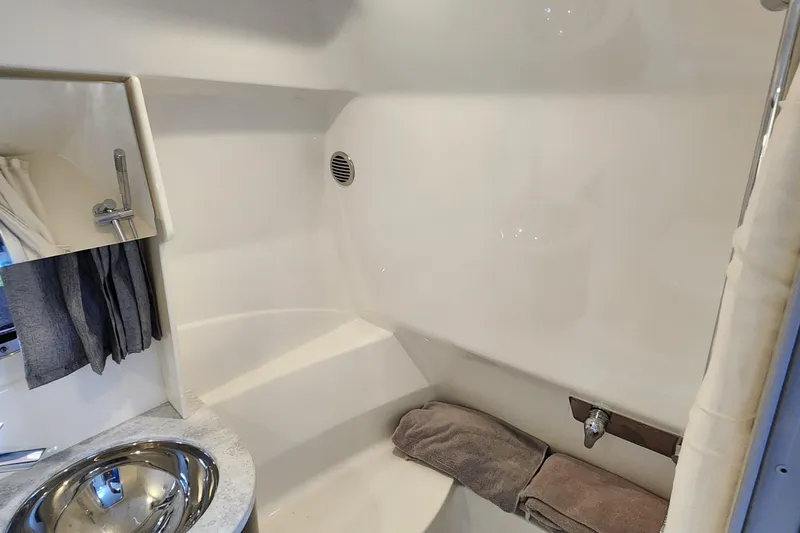 Slide: The Image of 2017 Formula 370 Super Sport bathroom with sink, shower, and towels. - 58