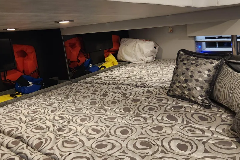 Slide: The Image of Interior cabin of 2017 Formula 370 Super Sport with patterned bedding and cushions. - 60