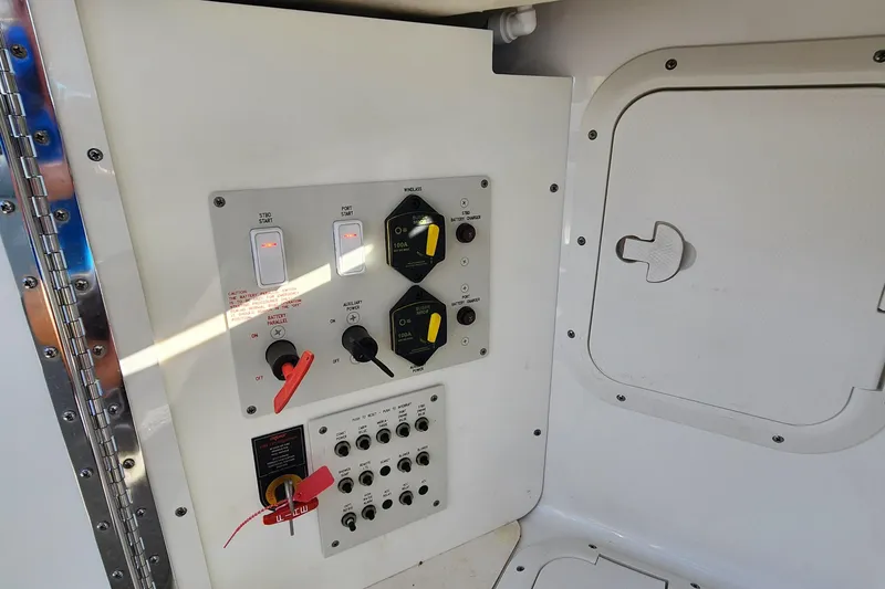 Slide: The Image of Control panel of a 2017 Formula 370 Super Sport boat, featuring switches and dials. - 69