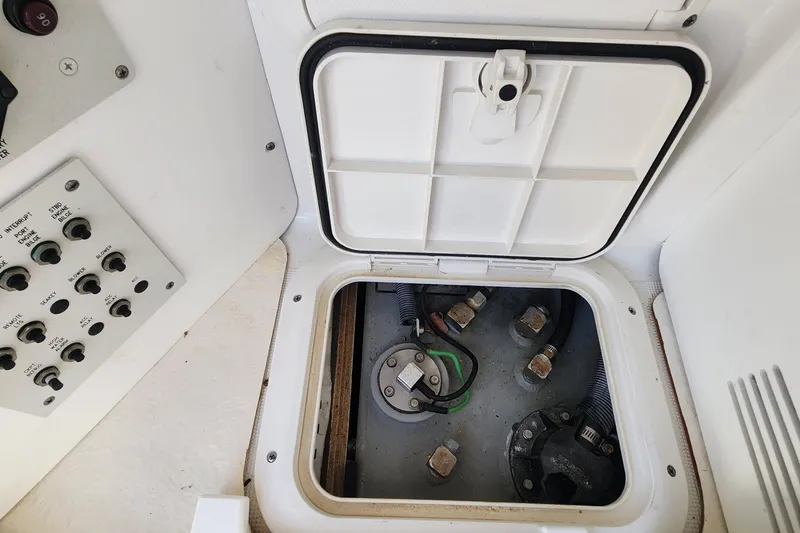 Slide: The Image of Access panel and control switches on a 2017 Formula 370 Super Sport boat. - 70