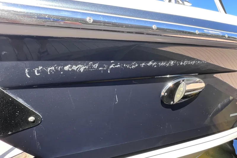 Slide: The Image of 2017 Formula 370 Super Sport boat with visible hull scratches and chrome detailing. - 76