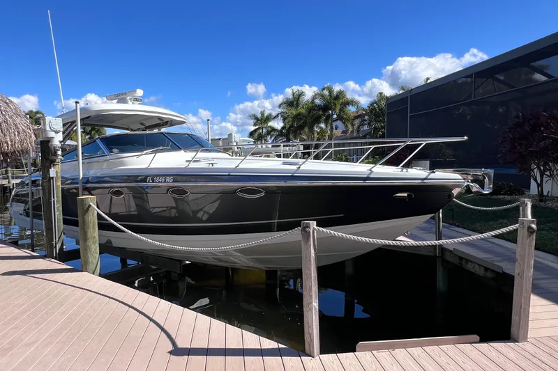 Slide: The Image of 2017 Formula 370 Super Sport boat docked under clear blue sky. - 9
