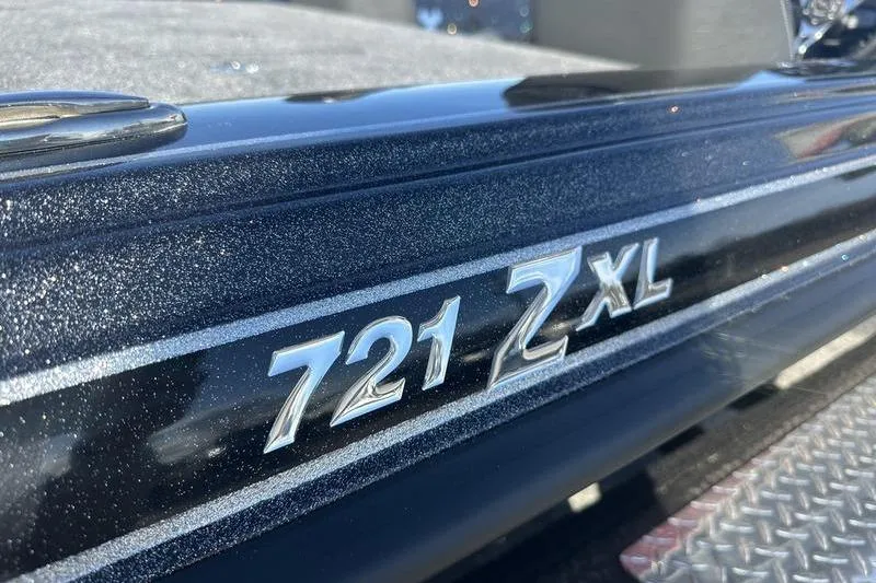 Slide: The Image of Close-up of 2026 Phoenix 721 ZXL boat model nameplate on metallic surface. - 11