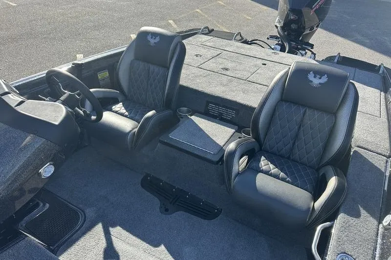 Slide: The Image of 2026 Phoenix 721 ZXL boat interior with dual black leather seats and steering wheel. - 12