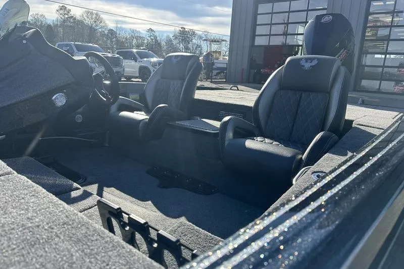 Slide: The Image of 2026 Phoenix 721 ZXL boat interior with two black seats and a steering console. - 14