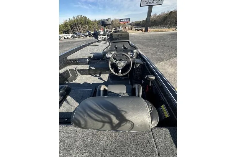 Slide: The Image of 2026 Phoenix 721 ZXL boat interior with steering wheel and dashboard controls. - 7