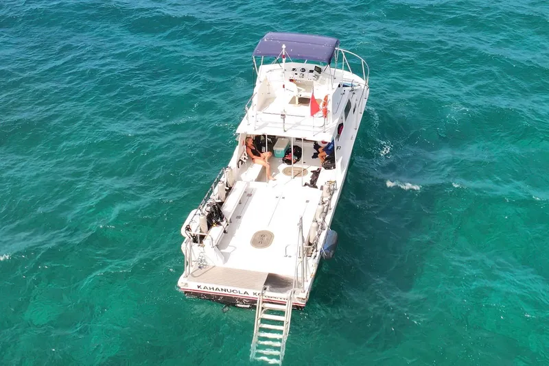 Slide: The Image of Aerial view of 1988 Custom 36 Hawaiian Lightning Radon boat on turquoise ocean. - 10
