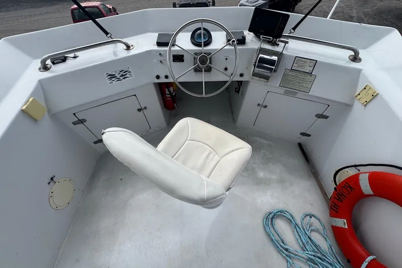 Slide: The Image of Cockpit of 1988 Custom 36 Hawaiian Lightning Radon boat with steering wheel and seat. - 17