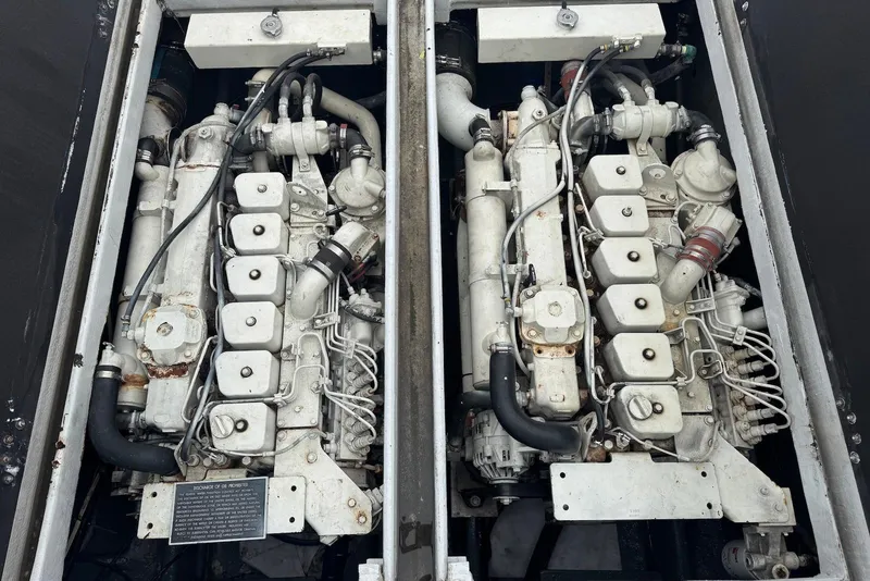 Slide: The Image of Twin engines of a 1988 Custom 36 Hawaiian Lightning Radon boat, detailed view. - 19