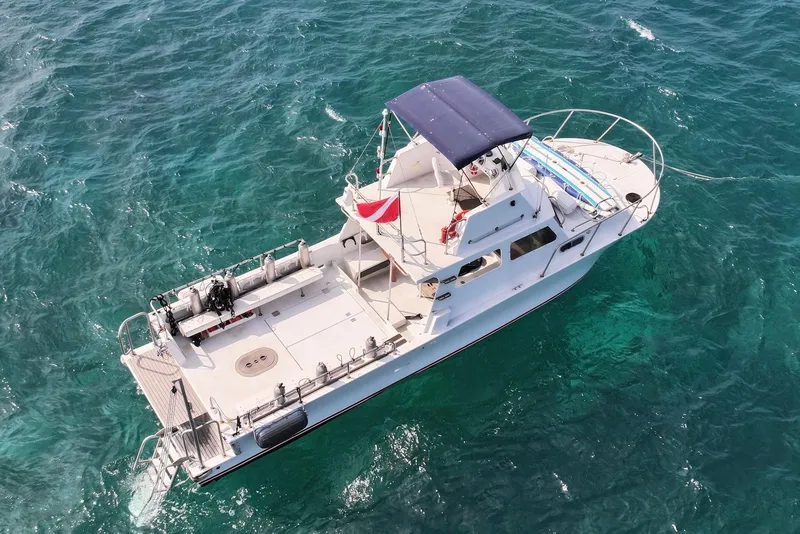 Slide: The Image of Aerial view of 1988 Custom 36 Hawaiian Lightning Radon boat on ocean. - 9
