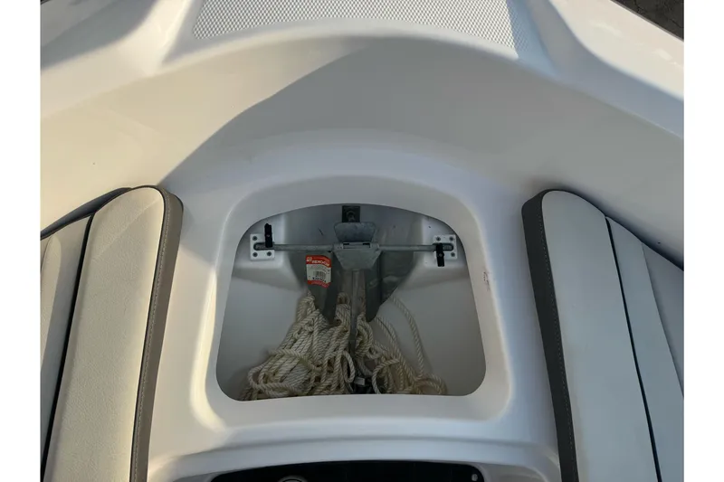 Slide: The Image of 2022 Yamaha Boats SX190 anchor storage with rope and anchor. - 26