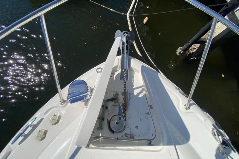 Slide: The Image of Bow view of 2008 Sea Ray Sundancer 330 with anchor and chain in water. - 17