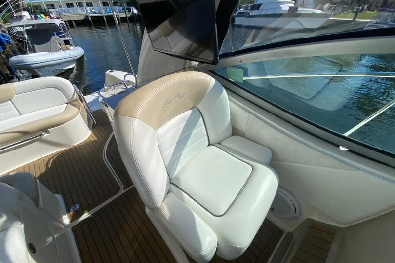 Slide: The Image of 2008 Sea Ray Sundancer 330 interior with white leather seating and wood flooring. - 32