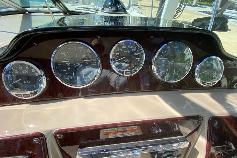 Slide: The Image of Dashboard of 2008 Sea Ray Sundancer 330 with gauges and controls. - 38