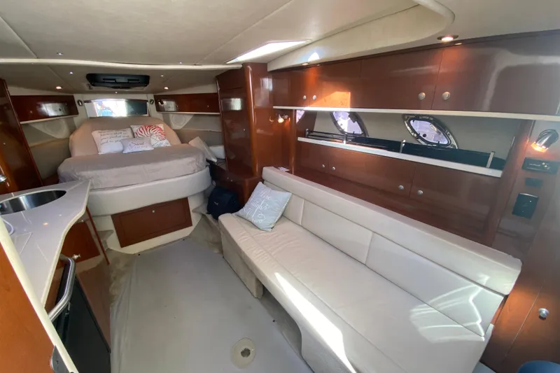 Slide: The Image of Luxurious 2008 Sea Ray Sundancer 330 cabin interior with bed, sofa, and kitchenette. - 40
