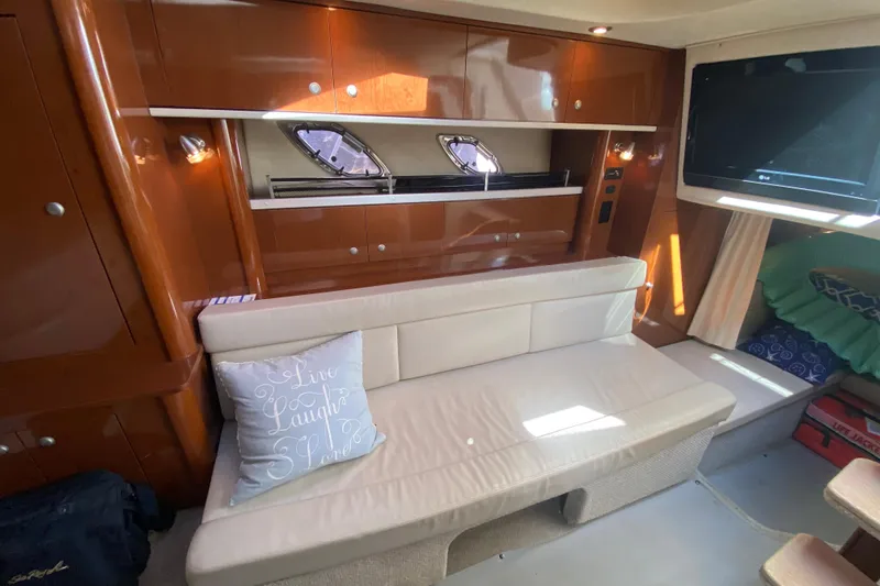 Slide: The Image of Luxurious interior of 2008 Sea Ray Sundancer 330 yacht with cozy seating and elegant wood finish. - 42