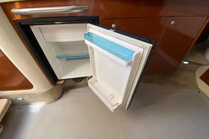 Slide: The Image of Open mini fridge inside 2008 Sea Ray Sundancer 330 yacht cabin. - 50