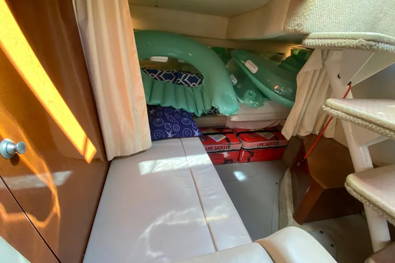 Slide: The Image of Interior cabin of 2008 Sea Ray Sundancer 330 with life jackets and inflatables. - 52